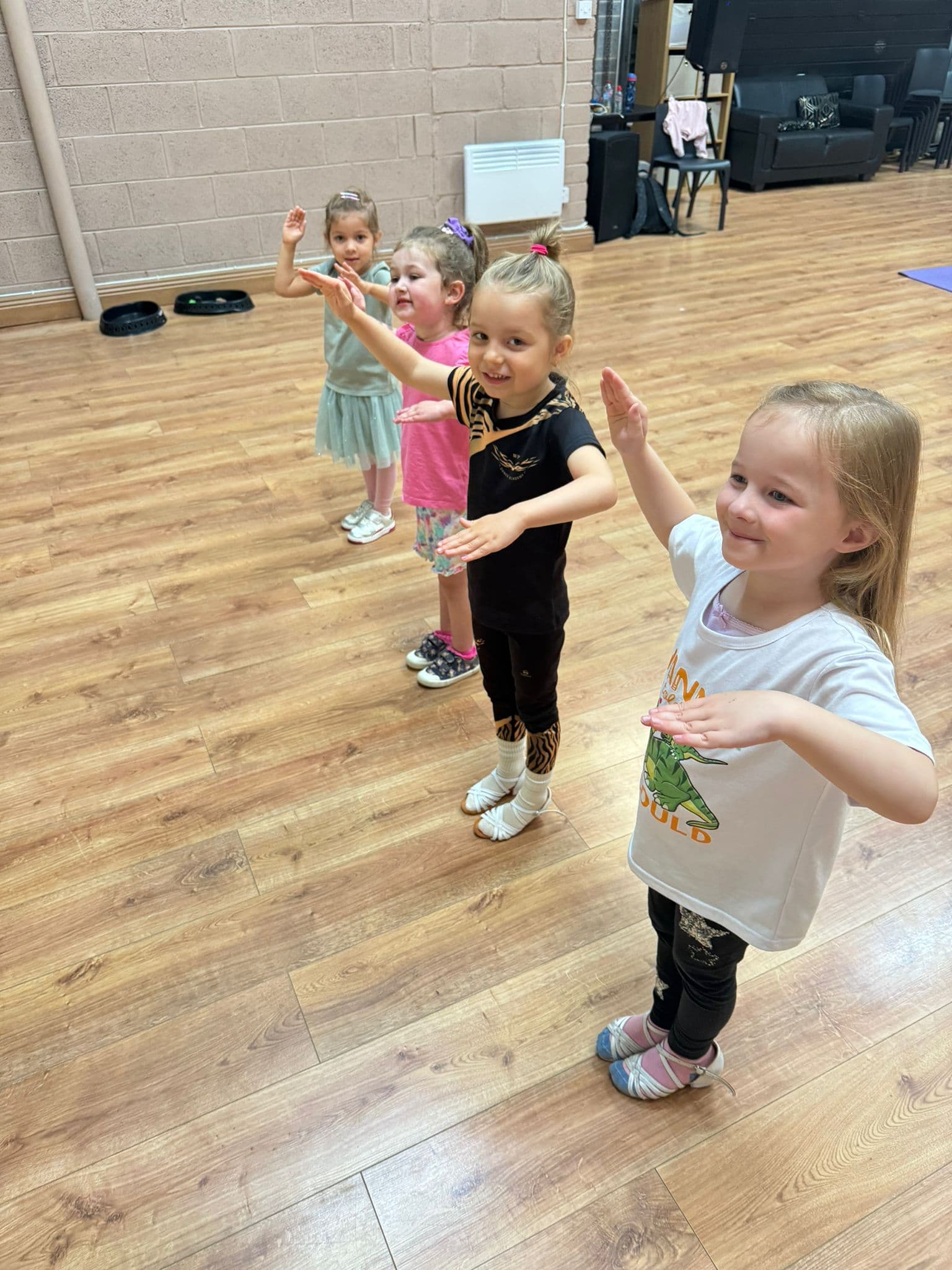 Young children smiling during class